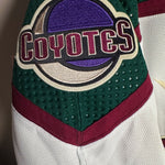 Brand New  Size: 60G   100% polyester  Officially licensed by the NHL  Made by Adidas  Relaxed Fit  Crewneck  Arizona Coyotes Crest  White/Green/Black/Burgundy   Steal at this price!  No refund if tag is removed